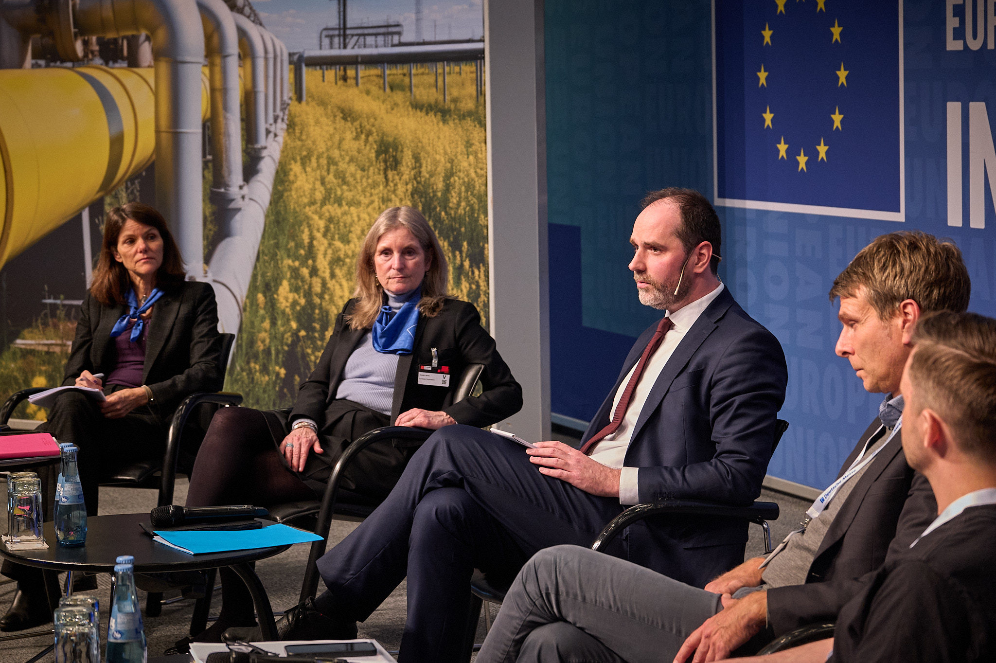 Five panel members discussing on stage, including Kerstin Jorna, the Director-General of this Commission department